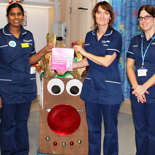 Clinical research nurses lead Christmas themed Research Rover to help spread the message that we do research